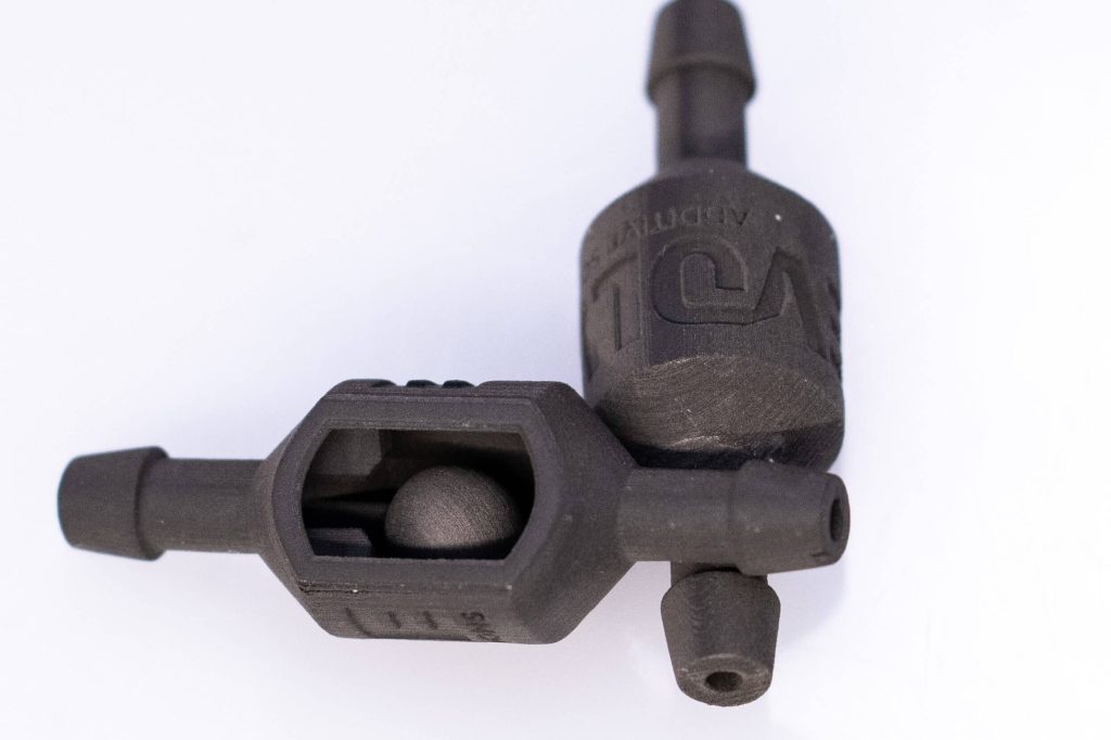 STEP 3D printed check valve. Photo via Evolve Additive